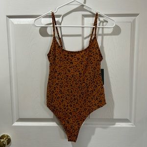 Target “Wild Fable” brand bodysuit in size Small. Burnt Orange & black.
